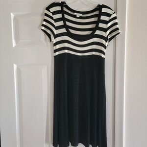 BCBG Black bottom and white top striped flirty and feminine dress.